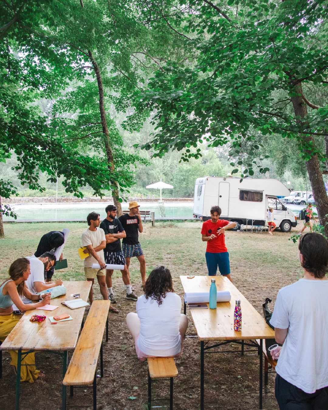 working session at the tables under the trees